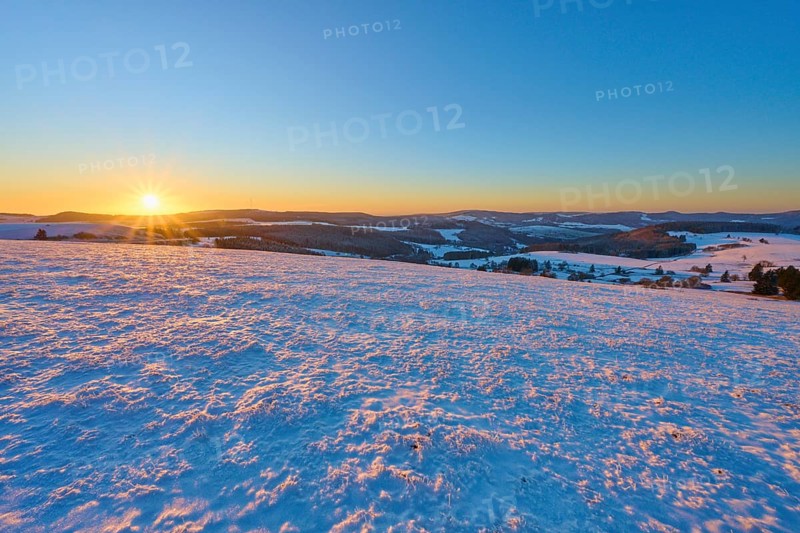 Snow-covered landscape at sunrise lying gently over the hills, winter, Wasserkuppe, Gersfeld, Rhön, Hesse, Germany, Europe
