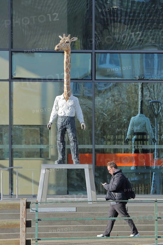 Modern building of the broadcasting station Arte of ARD and ZDF with sculpture giraffe man by Stephan Balkenhol, modern art, giraffe figure, giraffe man, animal figure, man figure, mythical creature, giraffe neck, pedestrian, television station, broadcasting, Strasbourg, Bas-Rhin, Alsace, France, Europe
