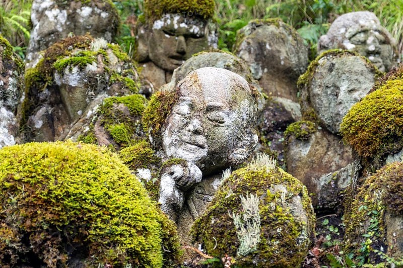 Close-up of moss-covered stone statue of rakan, the disciple of Buddha, Otagi Nenbutsu-ji temple, Kyoto, Japan, Asia