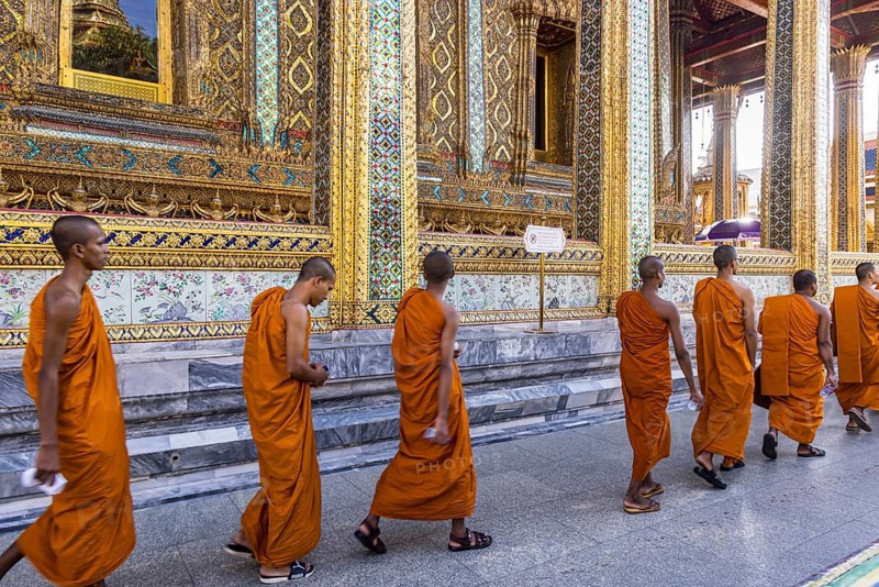 Wat Phra Kaeo temple, royal palace. Royal chapel with Buddhist monks and novices. Bangkok, Thailand, Asia