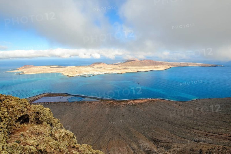 View from Lanzarote to La Graciosa island, largest island in Chinijo archipelago, in between El Rio strait, La Graciosa, Lanzarote, Canary Islands, Spain, Europe