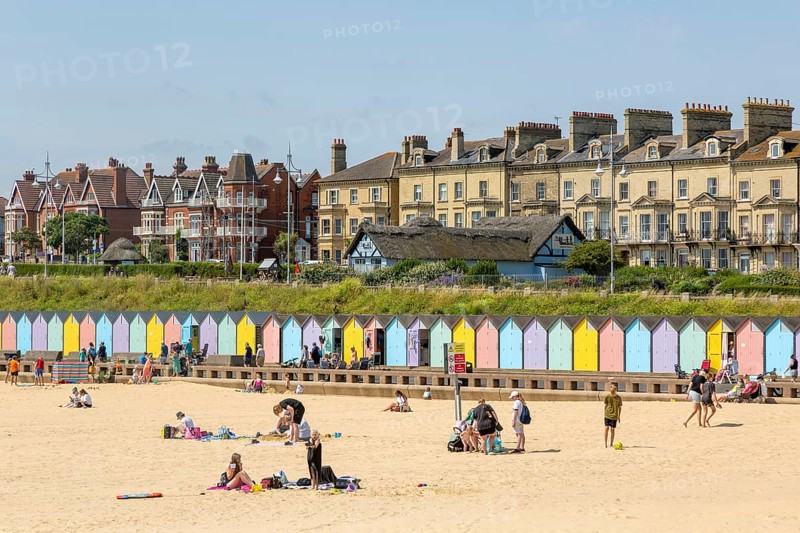 People enjoying sunny weather on sandy South Beach, Lowestoft, Suffolk, England, UK