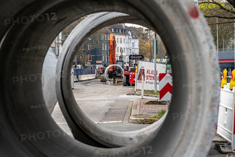 Concrete sewer pipes, stored on a construction site during sewer renovation work, on the Dickswall, city centre of Mülheim an der Ruhr, North Rhine-Westphalia, Germany, Europe