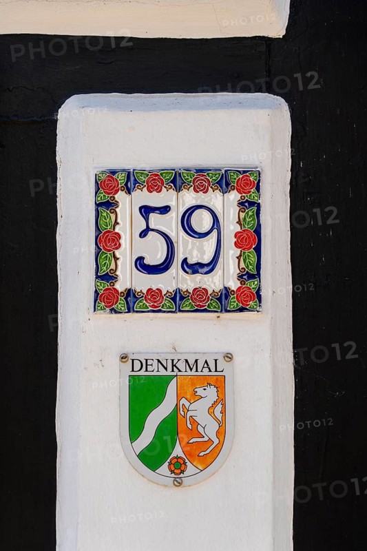 Listed building, mark of the state of North Rhine-Westphalia on a half-timbered house