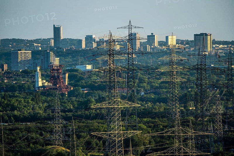 View over the central Ruhr area, from the north over Gelsenkirchen, with the former Consolidation mine on the skyscrapers of the city centre of Essen, energy supply, power lines, North Rhine-Westphalia, Germany, Europe