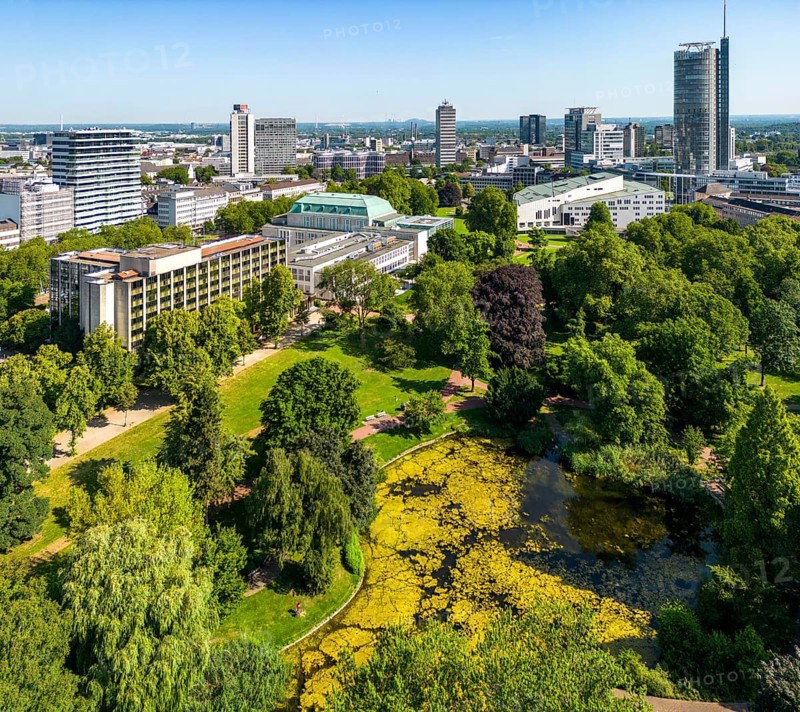 The skyline of Essen city centre, with the RWE Tower on the right and Stadtgarten Park in front, North Rhine-Westphalia, Germany, Europe