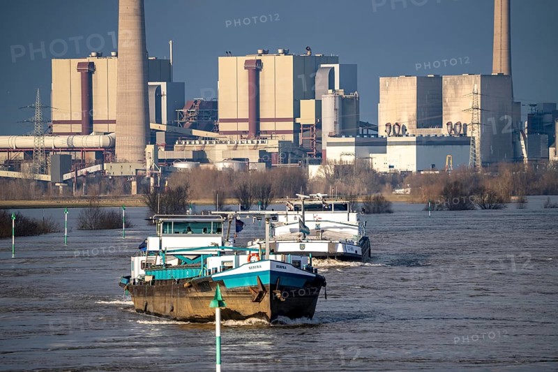 Cargo ships on the Rhine near Rheinberg, in the background the decommissioned Voerde coal-fired power station, which is currently being dismantled, flood, North Rhine-Westphalia, Germany, Europe
