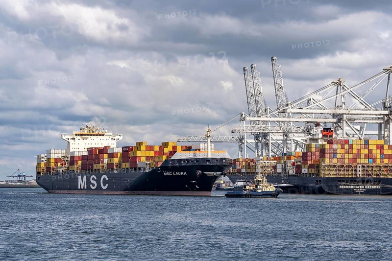 ECT Delta Container Terminal, in Europahaven, MSC Laura container freighter being towed by harbour tugs, Bremerhaven Express container ship being loaded and unloaded, seaport of Rotterdam, deep-sea port Maasvlakte 2, on an artificial land area, Netherlands