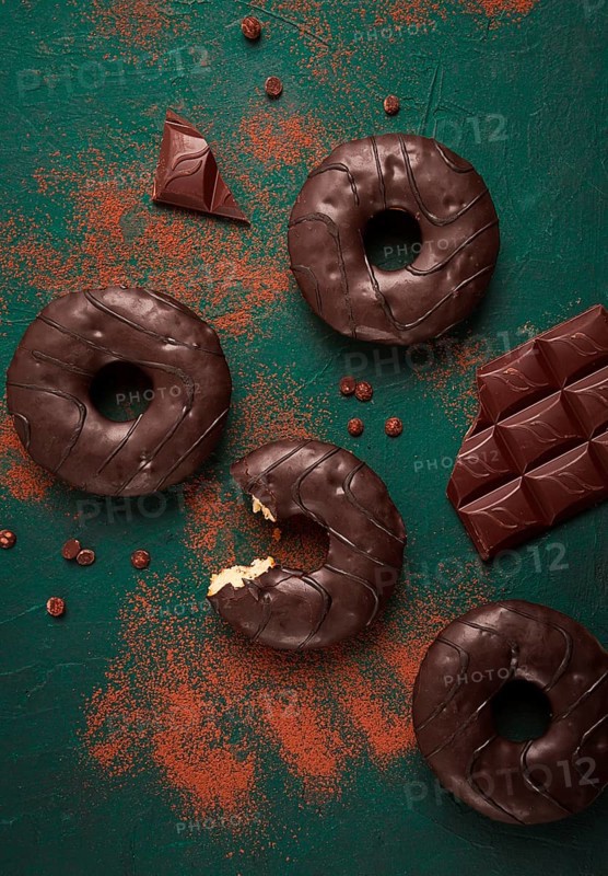 Donuts with cocoa, in chocolate glaze, top view, no people