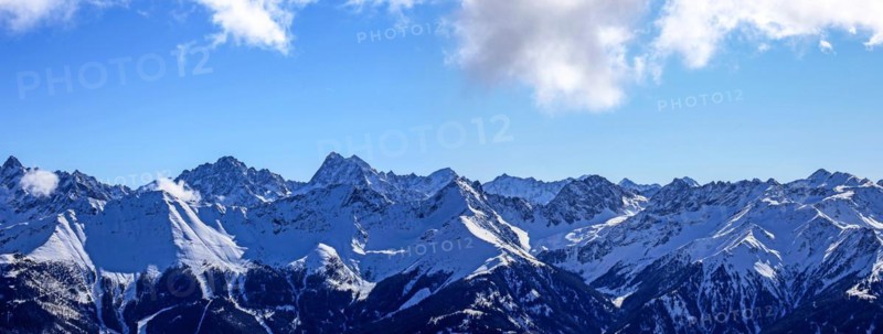Alpine panorama with snow-covered mountain peaks in winter. Taken in the ski resort of Serfaus Fiss Ladis (Tyrol, Austria)