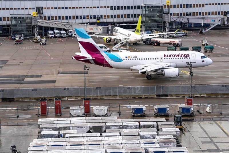 Düsseldorf Airport, Unit Load Devices, ULD, containers for baggage and freight for narrow-body and wide-body aircraft, baggage and freight are pre-packed in here and can then be quickly loaded or unloaded onto the aircraft, Eurowings, Air Baltic aircraft on the apron, at Terminal A, Düsseldorf, North Rhine-Westphalia, Germany, Europe
