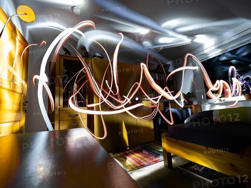 An Abstract image taken in a dark room and painting with light, by a person holding a hand held torch, walking through the room waving the torch around, causing light streaks and trails, combined with a long camera exposure time, Hesse, Germany, Europe