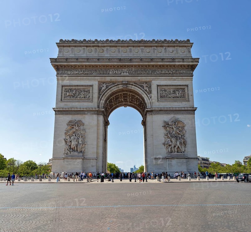 A central view of the Arc de Triomphe on a clear day with few people, Paris