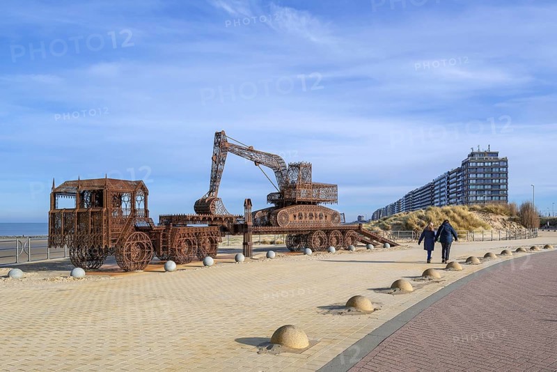 Caterpillar + Flatbed Trailer, artwork by Belgian neo-conceptual artist Wim Delvoye at seaside resort Westende, Middelkerke, West Flanders, Belgium, Europe