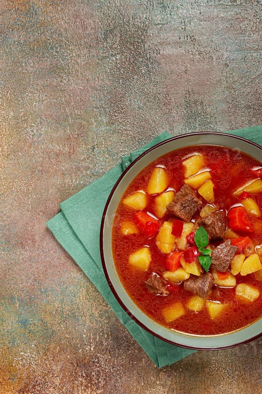 Meat goulash, with potatoes and carrots, sweet pepper, traditional Hungarian soup, homemade, no people