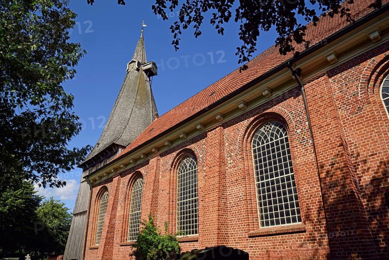 Europe, Germany, Lower Saxony, Altes Land near Hamburg, Hamburg Metropolitan Region, Jork-Estebrügge, Protestant St Martin's Church, built in 1702, twisted bell tower with tower clocks, Europe