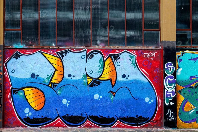 Graffiti in shades of blue and orange with a strong design language on an urban surface, Landau, Rhineland-Palatinate, Germany, Europe