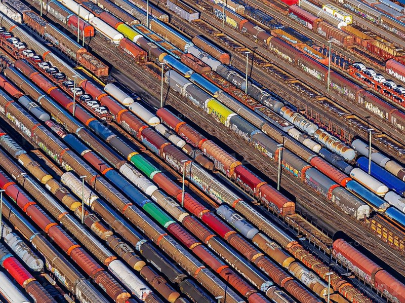 Deutsche Bahn AG marshalling yard. Many goods trains are parked on the tracks with tank wagons, car transporters and other wagons, companies transport a considerable part of their freight by rail, aerial view, Germany, Europe