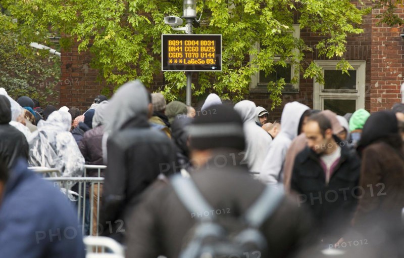 Refugees from Syria waiting to be registered at the Central Reception Centre for Asylum Seekers at the Berlin State Office for Health and Social Affairs, 09.10.2015