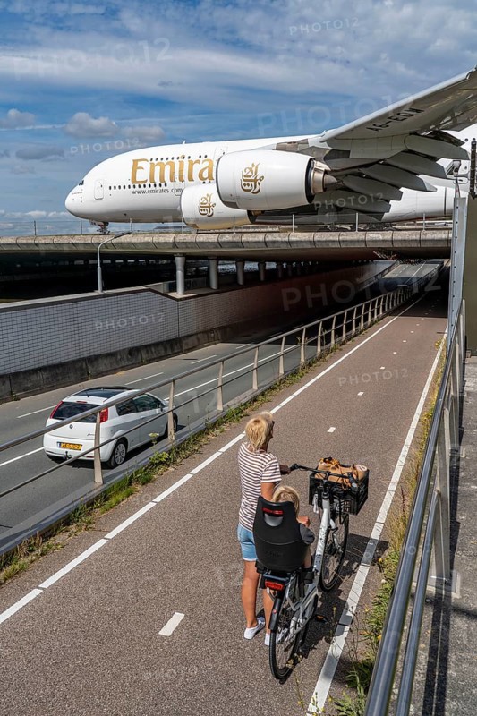 Amsterdam Schiphol Airport, Emirates Airbus A380, on the taxiway, to the Polderbaan runway, bridge over a road and a canal, Amsterdam, Netherlands