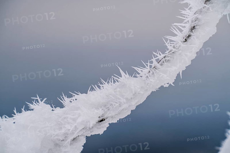 Snow-covered and icy fence, winter in Sauerland, Hochsauerlandkreis, at Kahler Asten, near Winterberg, few tourists, visitors, during the lockdown in January 2021, North Rhine-Westphalia, Germany, Europe
