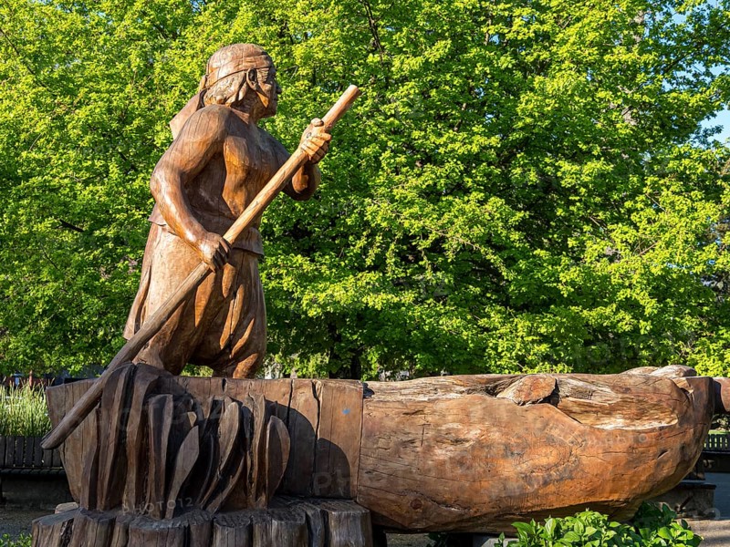 Wooden sculpture of man in a boat, central plaza, plaza de armas, Pucon, La Auracania, Chile, South America