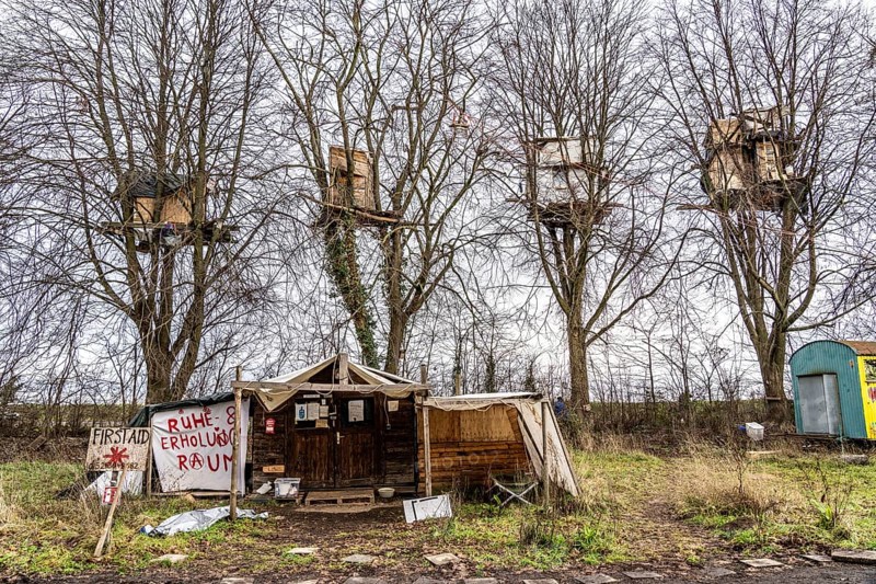Camp of climate activists in the rest of the village of Lützerath, the last place to be excavated at the Garzweiler 2 open-cast lignite mine, North Rhine-Westphalia, Germany, Europe