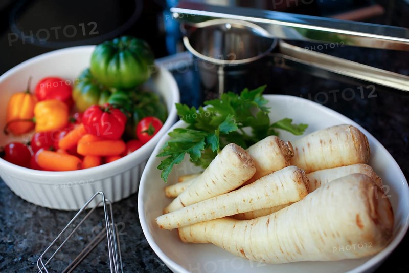 Swabian cuisine, preparation of parsley root and mashed potatoes with sour kidneys, grandmother's cooking, regional, ingredients, raw parsley root, various vegetables at the back, potato press, home cooking, typical Swabian, traditional cuisine reinterpreted, food photography, studio, Germany, Europe
