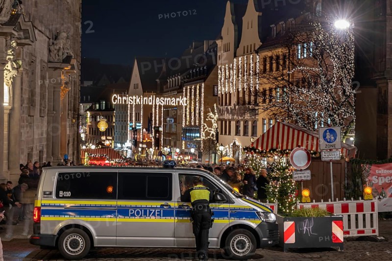 Police securing the Christkindlesmarkt, on the left the old town hall building, main market, Nuremberg, Middle Franconia, Bavaria, Germany, Europe