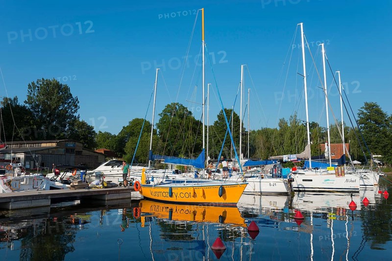 Sailing boats in the harbour with red buoys and a clear blue sky in summer, Gizycko, Warminsko-Mazurskie, Warminsko-Mazurskie, Poland, Europe