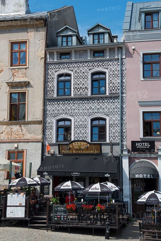 Cosy restaurant in a historic building with a decorative façade and parasols in the city centre, Huas on Grodzka Street, Lublin, Poland, Europe
