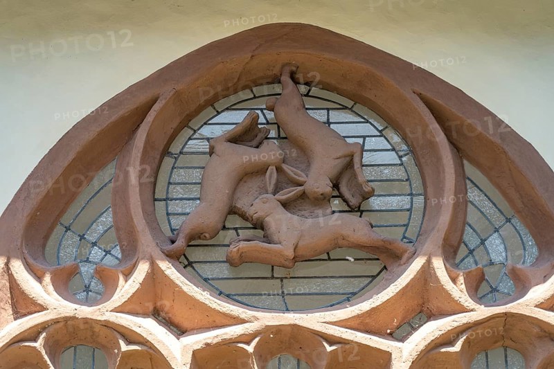 Three-hare window in the inner courtyard of Paderborn Cathedral, Paderborn, North Rhine-Westphalia, Germany, Europe