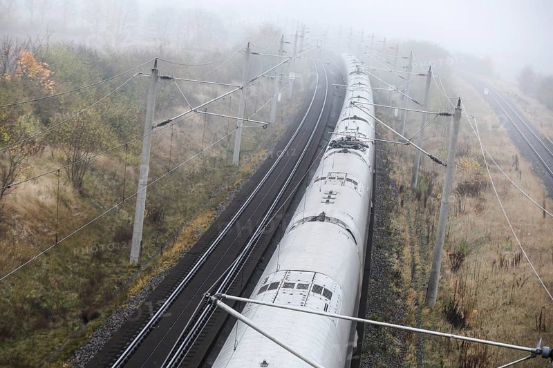 A Deutsche Bahn ICE train runs in foggy autumn weather on a railway line near Neugarten, 06.11.2024, Neugarten, Brandenburg, Germany, Europe