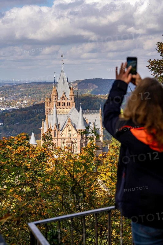 Drachenburg Castle, on the Drachenfels, a mountain in the Siebengebirge on the Rhine between Bad Honnef and Königswinter, tourist taking a mobile phone photo, North Rhine-Westphalia, Germany, Europe