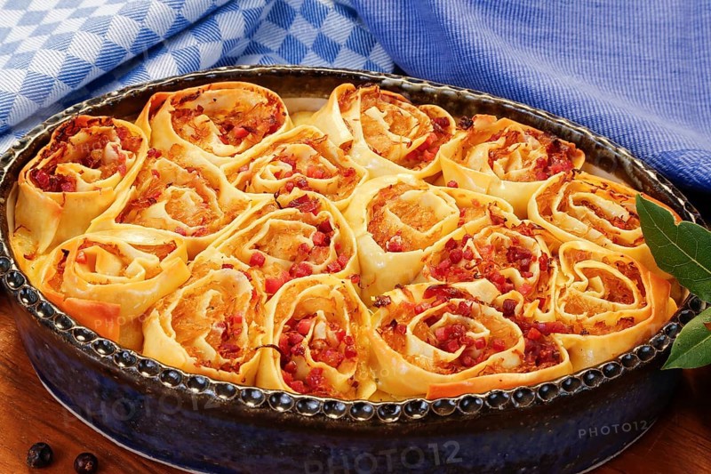 Swabian cuisine, Swabian doughnuts in a casserole dish, Swabian pasta sack, stuffed pasta pancakes with sauerkraut and smoked meat, savoury, salty, main course, raw pasta pancakes, grandmother's cooking, regional, home cooking, typical Swabian, traditional cuisine, food photography, studio, Germany, Europe