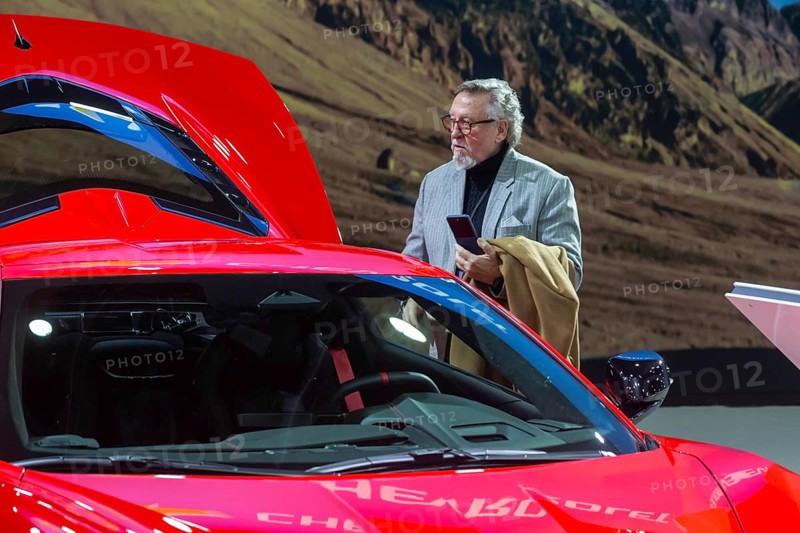 Detroit, Michigan USA - 10 January 2025 - A visitor examines a 2025 Chevrolet Corvette Stingray at the 2025 Detroit Auto Show