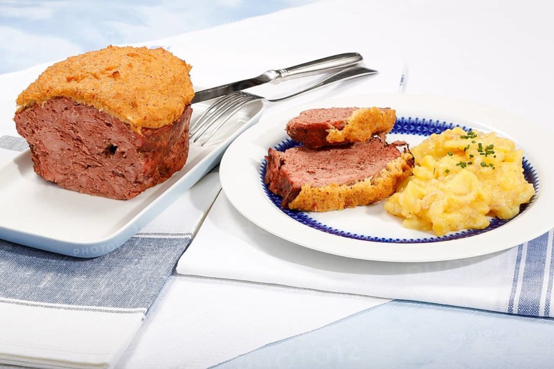 Swabian cuisine, Stuttgarter Leberkäs in a horseradish-mustard coating, Swabian potato salad, Leberkäse, meat loaf, mustard crust, grandmother's cooking, regional, home cooking, serving platter, plate, cutlery, typical Swabian, traditional cuisine, food photography, studio, Germany, Europe