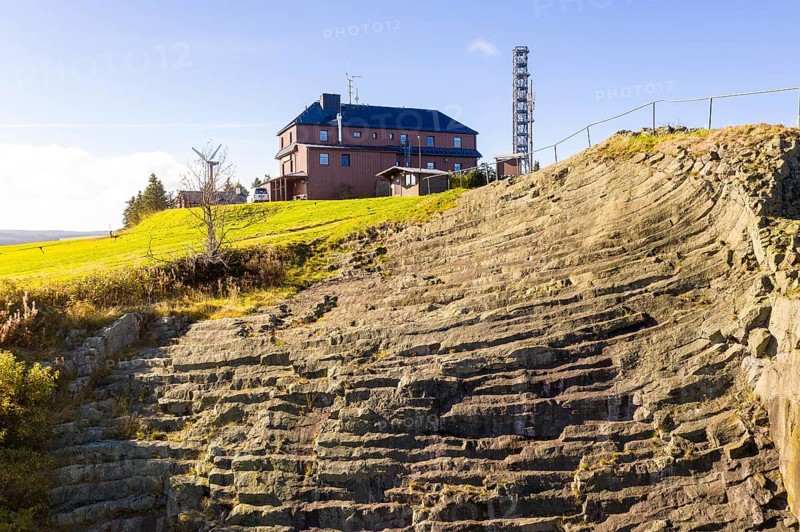 Basalt outcrop from a former quarry on the Hirstsein with mining hut, Erzgebirge, Marienberg Saxony, Germany, Europe