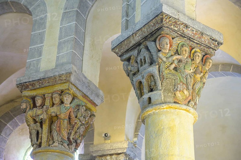 Colourfully painted capitals in the Romanesque church of Saint-Nectaire, Département Puy-de-Dôme, France, Europe