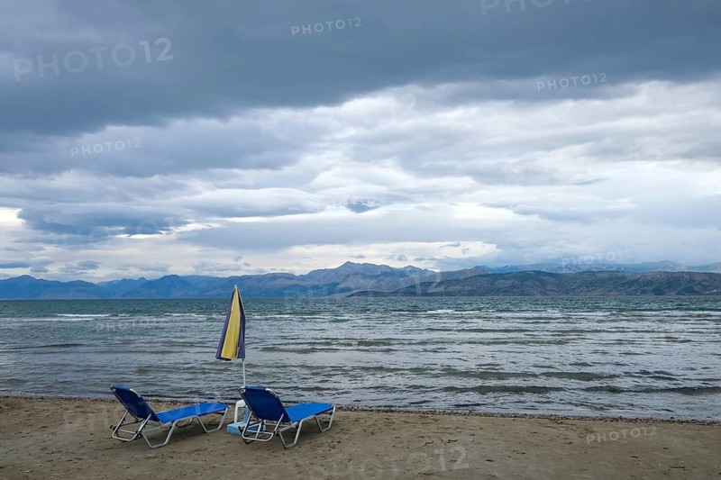 Kalamaki, Corfu, Greece, View from Kalamaki beach in the north-east of the Greek island of Corfu over the Ionian Sea towards mainland Albania, Europe