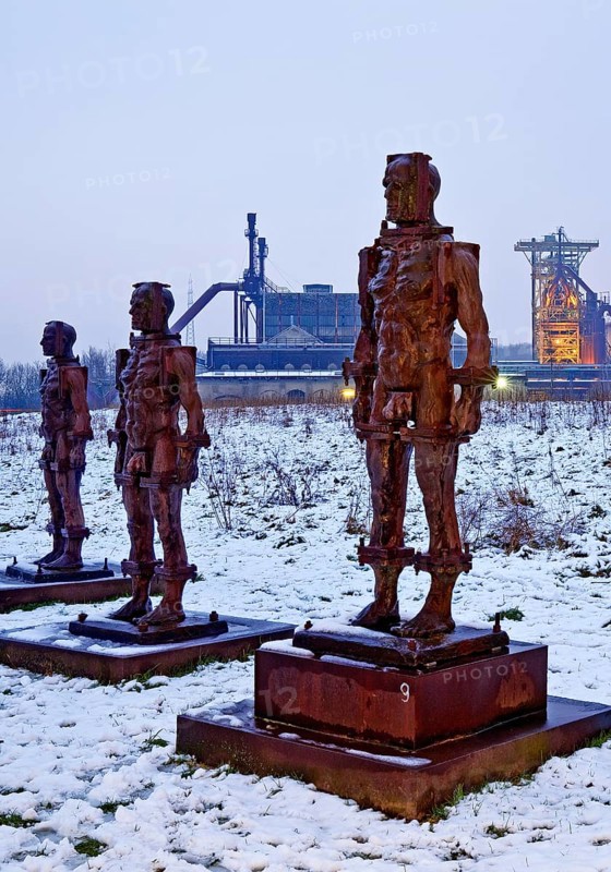 People made of iron, multi-part iron sculpture by Zbigniew Fraczkiewicz in front of the Henrichshütte in winter, Hattingen, Ruhr area, Germany, Europe