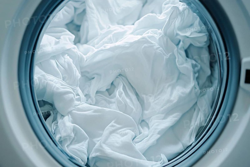Close up of white clothes inside of washing machine. Generative Ai, AI generated