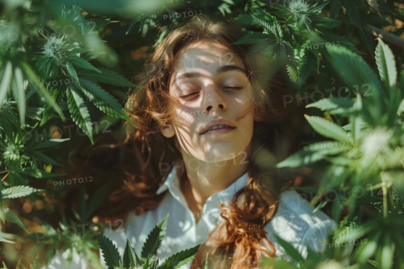 Teenager in an intoxicated state in a hemp field, surrounded by hemp leaves, cannabis, industrial hemp, symbolic image, health risk, drug use, illegal, legal, for medical, industrial purposes or food production, AI generated, AI generated, AI generated