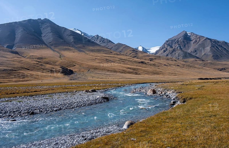 Blue river in the Burkhan valley, mountain landscape with glaciated peaks and golden meadows, Terskey Ala-Too, Tien Shan, Issyk Kul province, Kyrgyzstan, Asia
