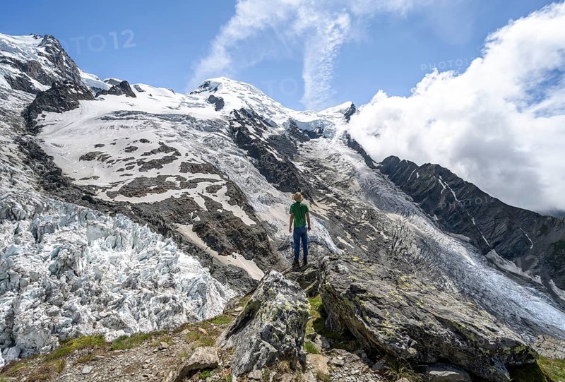 Mountaineers on the glacier, High alpine glaciated mountain landscape, La Jonction, Glacier des Bossons meets Glacier de Taconnaz, Summit of Mont Maudit and Mont Blanc, Chamonix, Haute-Savoie, France, Europe