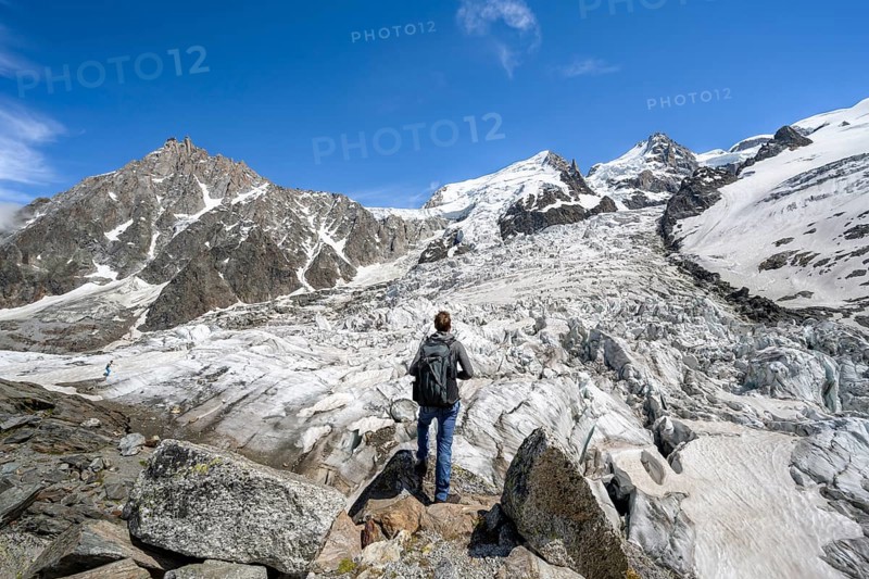 Mountaineers on the glacier, High alpine glaciated mountain landscape, La Jonction, Glacier des Bossons meets Glacier de Taconnaz, Summit of the Aiguille du Midi, Mont Maudit and Mont Blanc, Chamonix, Haute-Savoie, France, Europe
