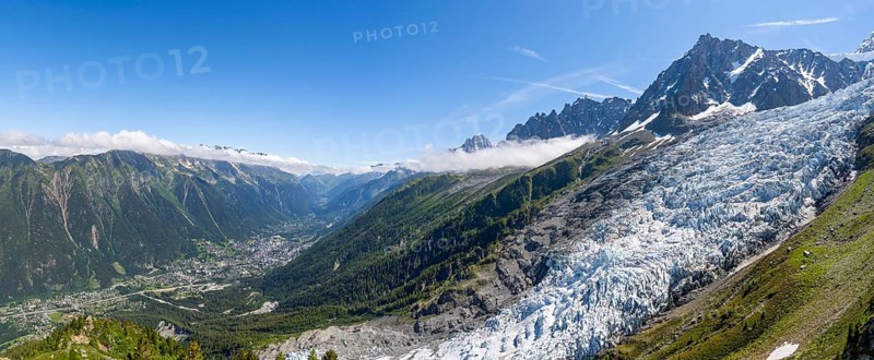 Panorama, mountain landscape with glacier Glacier des Bossons and summit of the Aiguille du Midi, view into the valley with the village of Chamonix, Chamonix, Haute-Savoie, France, Europe