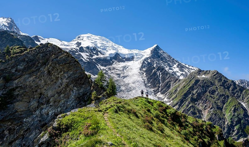 Mountaineer on a hiking trail in front of mountain landscape with glacier, view of glacier Glacier de Taconnaz, hike La Jonction, Chamonix, Haute-Savoie, France, Europe