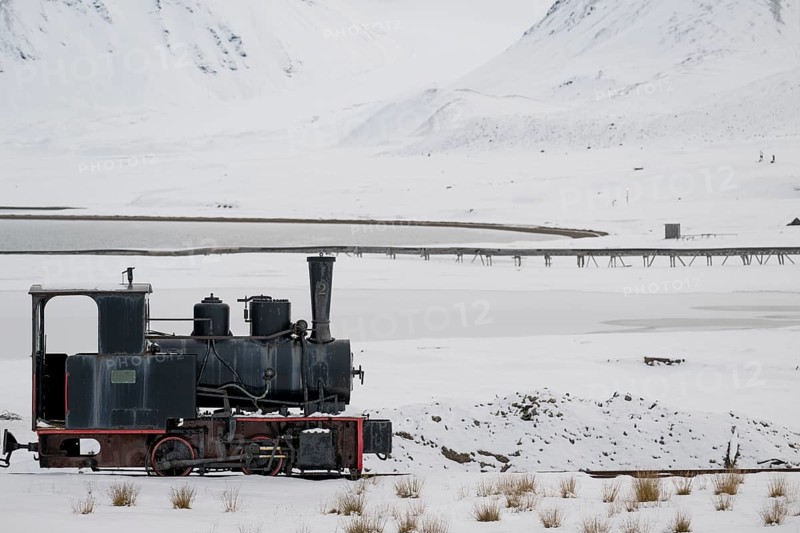 Historic mine railway in winter landscape, Kongsfjord, Ny-Ålesund, Spitsbergen Island, Svalbard and Jan Mayen archipelago, Norway, Europe