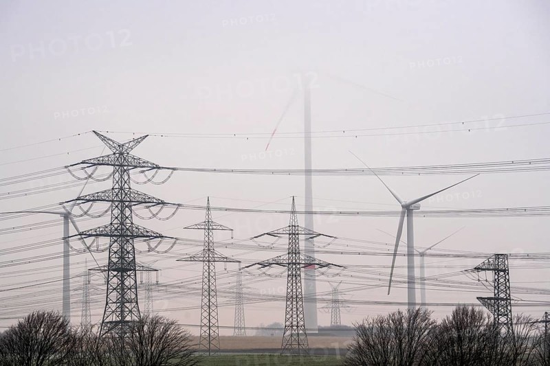 Wind farm in the fog, high-voltage pylons, dark doldrums, no wind no direct sunlight, in the Rhenish lignite mining area, south of Rommerskirchen North Rhine-Westphalia, Germany, Europe